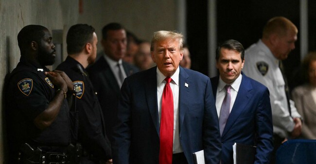 (FILES) Former US President Donald Trump, with his lawyer Todd Blanche, walks to speak to the press at the end of the day of his trial for allegedly covering up hush money payments linked to extramarital affairs at Manhattan Criminal Court in New York City on May 16, 2024. The judge in Donald Trump's New York criminal case has delayed to November 19 a decision on potentially throwing out the US president-elect's conviction, the court said Tuesday. (Photo by ANGELA WEISS / POOL / AFP)