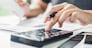 Man using calculator Accounting Calculating Cost Economic bills with money stack step growing growth saving money in home , finance concept