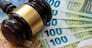 Judge's gavel on euro bills background. bribery or corruption concept