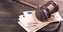 Gavel and four euro banknotes.Auction bidding, judicial system corruption concept.Toned