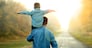 happy father and son walk in nature