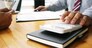 Accountant verify the business and saving money stacking gold coins with calculator. Accountancy Concept.