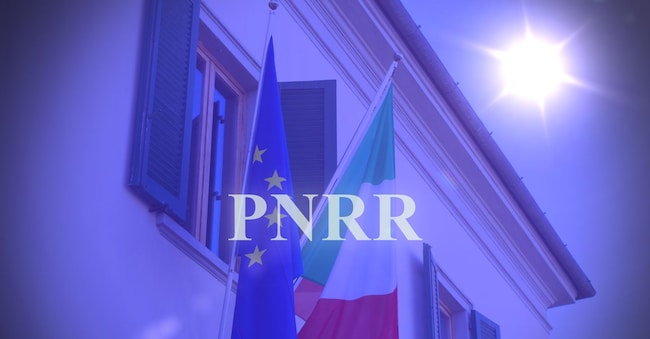 Shot of the Italian and the European flags in Italy with the text "Pnrr