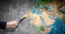 Close up of hand painting Earth planet with brush. Elements of this image are furnished by NASA