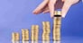 serie with columns of "gold" coins and fingers