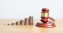 judge gavel with money coins stack on desk. Law cost, lawyer, judgment, justice auction and bidding concepts