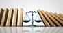 Legal help and lawyer services concept as a group of falling domino pieces being supported by a justice scale as a law aid and solving problems metaphor as a 3D illustration.