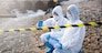 Scientist or Biologist in a protective suit and protect mask collects sample of waste water from industrial for analyze, problem environment, Ecologist sampling water from the river with test tube