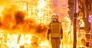 Firefighter with his protective suit working controlling the burning of a Falla during the Valencian fiestas.