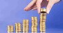 serie with columns of "gold" coins and fingers