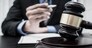 Judge or a lawyer works documents in the courtroom and analyze the various laws for justice and accuracy, Litigation and justice concept.