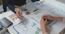Team work process Team of business people searching for piles of papers and having a meeting Discuss business statistics, profits, financial growth rates in graph papers. financial data chart.