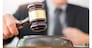 Male Judge lawyer In A Courtroom Striking The Gavel on sounding block in his office.