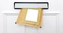 A padded envelope in the letterbox of a white front door, blank label for you to add your own name and address.