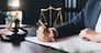 Judge gavel with Justice lawyers, Business woam in suit or lawyer working on a documents. Legal law, advice and justice concept.