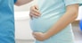 Birthing centre. Pregnant woman during early labour at a birthing centre.