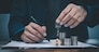 Closeup hand signature Bank managers approve mortgages for home and housing loans.