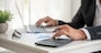 Asian businessman hands calculating number, graph, chart audit planning accountancy on business report. Asian professional Business man hands using calculator counting tax financial bill. Tax audit Finacial concept.