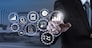 Business data analytics management with connected gear cogs with KPI financial charts and graph.Businessman hand pressing an imaginary button on virtual screen