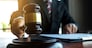Lawyer working with contract papers on the table in office. consultant lawyer, attorney, court judge, concept.