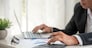 Asian businessman hands calculating number, graph, chart audit planning accountancy on business report. Asian professional Business man hands using calculator counting tax financial bill. Tax audit Finacial concept.