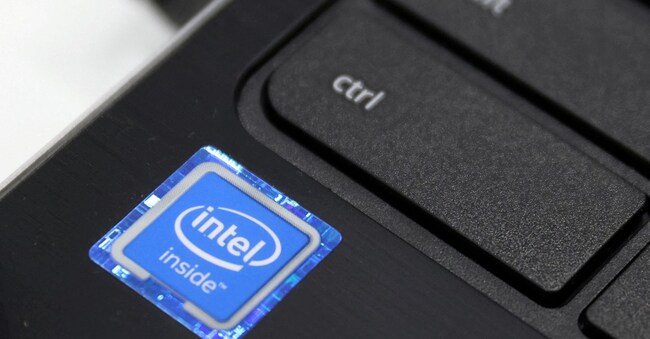 FILE PHOTO: An Intel Corporation logo is seen on a sticker on a laptop for sale in Queens, New York, U.S., November 16, 2021. REUTERS/Andrew Kelly/File Photo