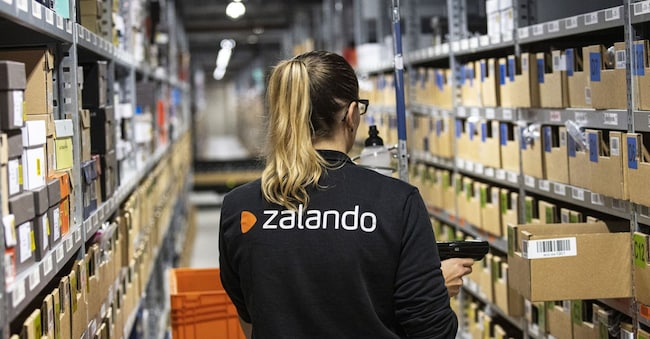 An order picker scans barcodes while collecting customer delivery orders inside the Zalando SE online shopping logistics and fulfillment center in Erfurt, Germany, on Thursday, Aug. 15, 2019. Buying clothing online is popular in Europe's largest economy, but it's also the category that gets returned the most because many shoppers buy more than they need to try on different garments in the comfort of their own home. Photographer: Alex Kraus/Bloomberg