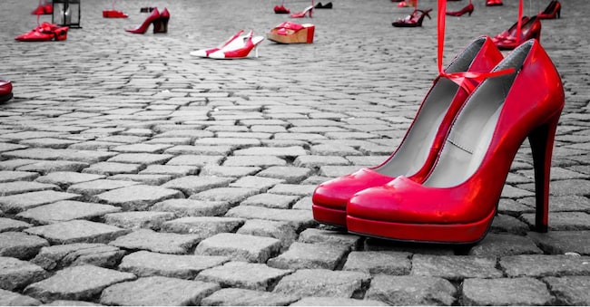 Red shoes to stop violence against women on a city square