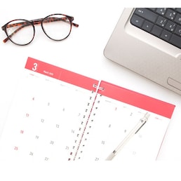 Working with the laptop and organizing monthly activities and appointments in the calendar, Top view