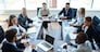 Businespeople at panel discussion in board room