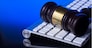 Wooden law gawel on computer keyboard, internet auction concept