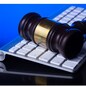 Wooden law gawel on computer keyboard, internet auction concept