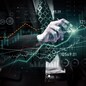 Businessman analyst working with digital finance business data graph showing technology of investment strategy for perceptive financial business decision. Digital economic analysis technology concept.