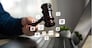 A man holding a judge's gavel symbolizes the services of a lawyer, the judicial system, and legal rights. Judicial authority, legal representation, justice. Protection of rights.