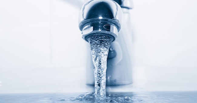 Faucet with flowing water closeup