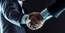 closeup of a business handshake partners.photo on a black background and has space for your text.