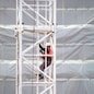 Worker on crane at site