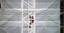 Worker on crane at site