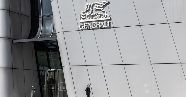 MILAN, ITALY - APRIL 06: A man walks past the entrance of the Generali Tower, aka "The Twisted One", a skyscraper hosting the headquarters of Italian insurance company Assicurazioni Generali, designed by late Anglo-Iraqi architect Zaha Hadid and located on CityLife district on April 06, 2023 in Milan, Italy. CityLife is a residential, commercial and business district featuring the largest car-free area in Milan and one of the biggest in Europe: the district is the result of the redevelopment project of the former 90 acres grounds of Fiera Milano trade and exhibition centre, after its partial relocation to the nearby town of Rho. (Photo by Emanuele Cremaschi/Getty Images)