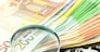 Euro Notes with calculator and magnifier. Closeup