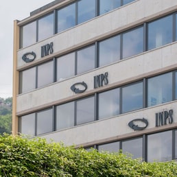 Carrara, Italy - May 24, 2020 - A building of the INPS, the national social security institute that deals with providing pensions and collecting labor contributions