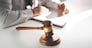 lawyer consultant working on legal documents in courtroom, justice concept.