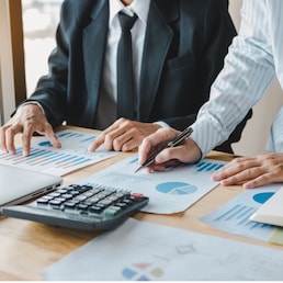 Business people working together at office room table and balancing budget.
