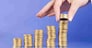 serie with columns of "gold" coins and fingers
