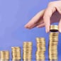 serie with columns of "gold" coins and fingers
