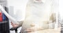 pregnancy, business and work concept - smiling pregnant businesswoman sitting at office table and reading papers over urban double exposure effect