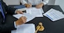 Legal counsel presents to the client a signed contract with gavel and legal law. justice and lawyer concept.