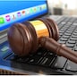 Online internet auction. Gavel on laptop.  3d
