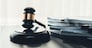Black wooden gavel hammer and legal document in empty law firm or lawyer office background as justice and legal system for lawyer and judge, Legal authority and fairness in trials concept. equility