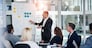 Man, meeting and whiteboard with staff in office for workflow steps, diagram or teamwork for web design. Male presenter, developer and meeting of strategy process, chart and interface idea proposal.
